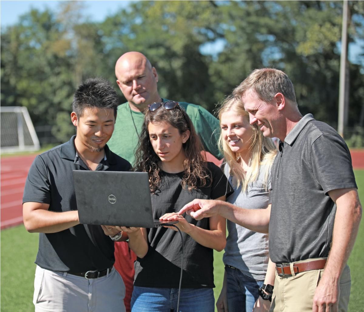 Kei Kawata works with his team on the football field.