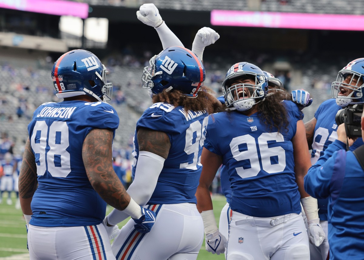 Oct 24, 2021; East Rutherford, New Jersey, USA; New York Giants nose tackle Austin Johnson (98) huddles with nose tackle Austin Johnson (98) and defensive tackle David Moa (96) before the game against the Carolina Panthers at MetLife Stadium.