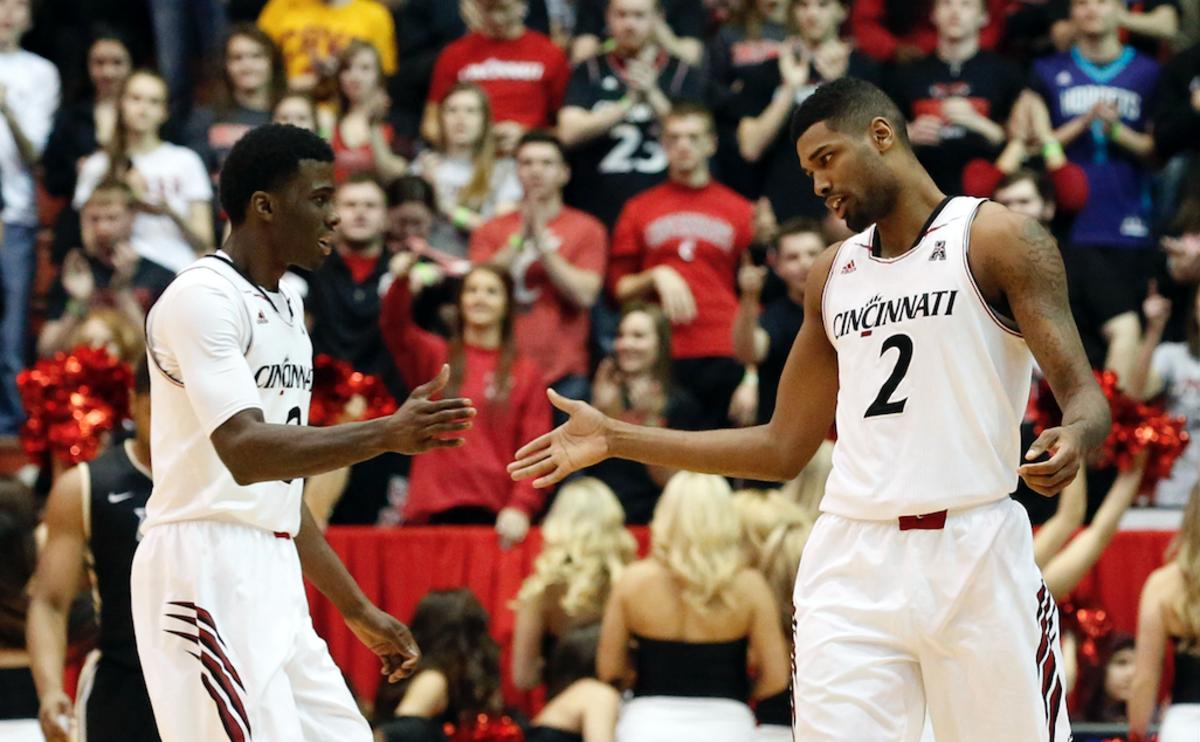 Feb 25, 2015; Cincinnati, OH, USA; Cincinnati Bearcats forward Shaquille Thomas (3) celebrates with forward Octavius Ellis (2) against the UCF Knights during the second half at Fifth Third Arena. The Bearcats won 83-60. Mandatory Credit: Aaron Doster-USA TODAY Sports