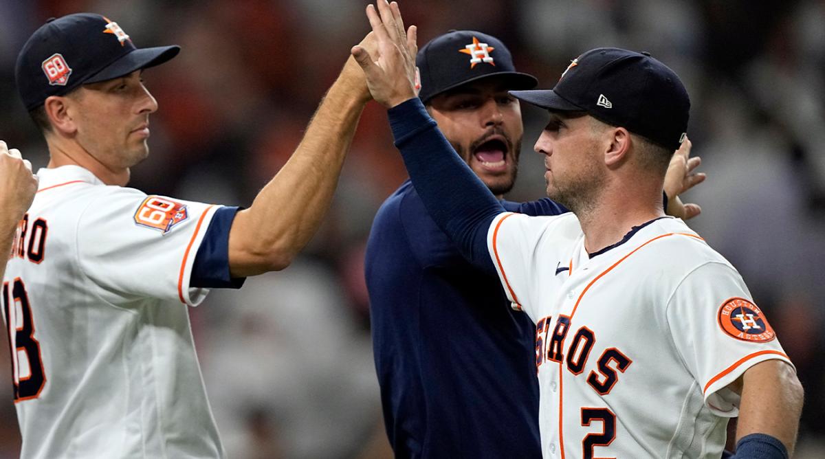 Houston Astros’ Alex Bregman (2), celebrates with Jason Castro (18) and Lance McCullers Jr. after a baseball game against the New York Yankees Thursday, June 30, 2022, in Houston. The Astros won 2-1.