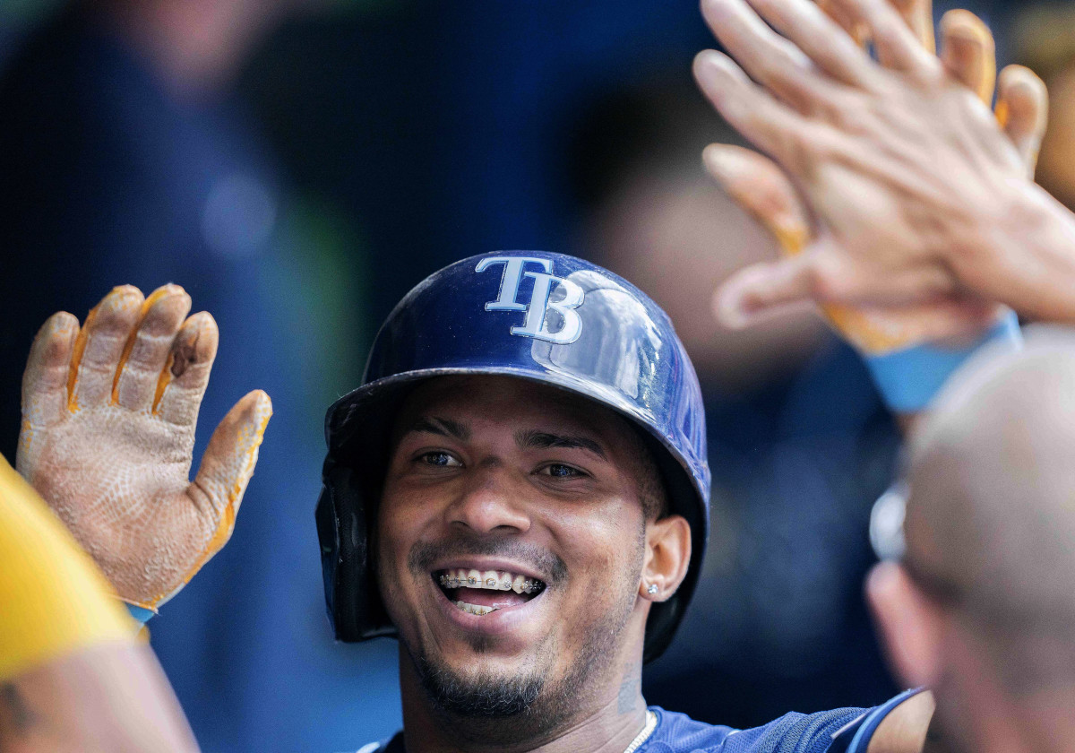 Tampa Bay Rays shortstop Wander Franco (5) celebrates in the dugout after hitting a home run against the Toronto Blue Jays during the sixth inning at Rogers Centre. Mandatory Credit: Nick Turchiaro-USA TODAY Sports