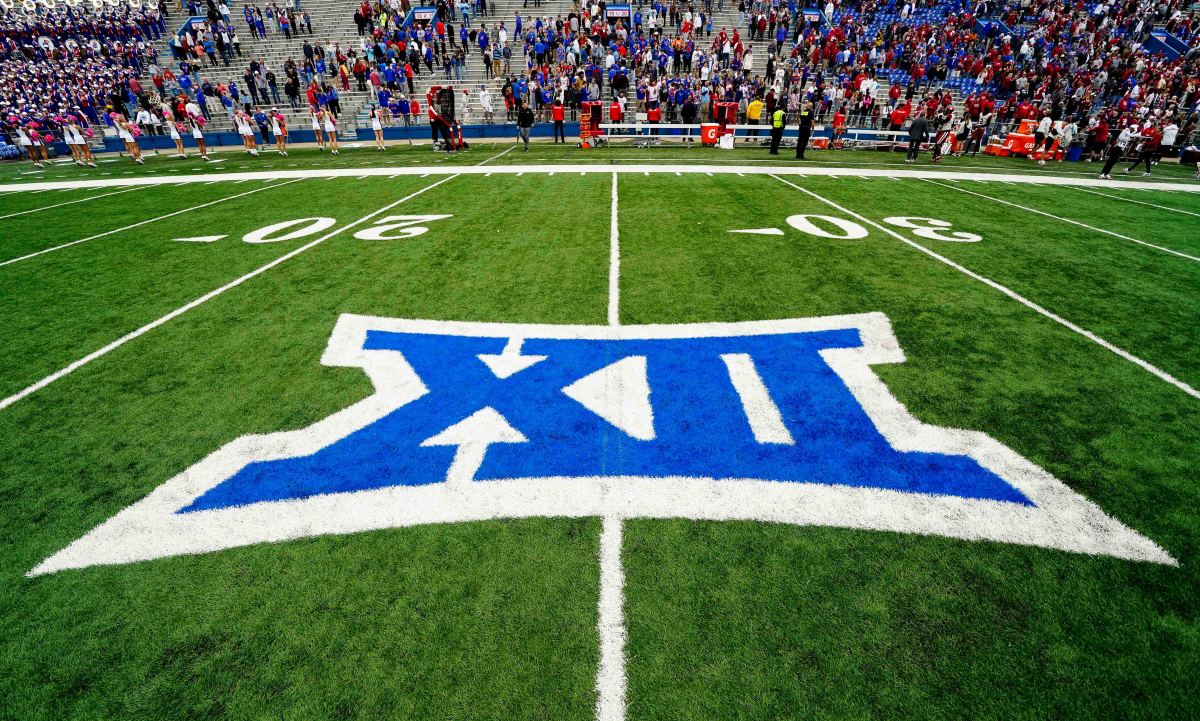 A general view of the Big 12 Conference logo on the field after the game between the Kansas Jayhawks and the Oklahoma Sooners at David Booth Kansas Memorial Stadium.