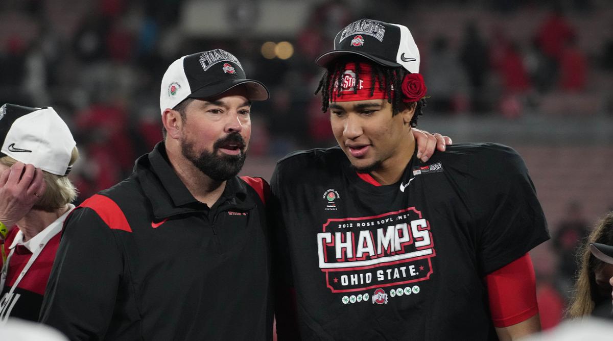 Jan 1, 2022; Pasadena, CA, USA; Ohio State Buckeyes head coach Ryan Day and quarterback C.J. Stroud (7) celebrate on the podium after the win against the Utah Utes during the 2022 Rose Bowl college football game at the Rose Bowl.
