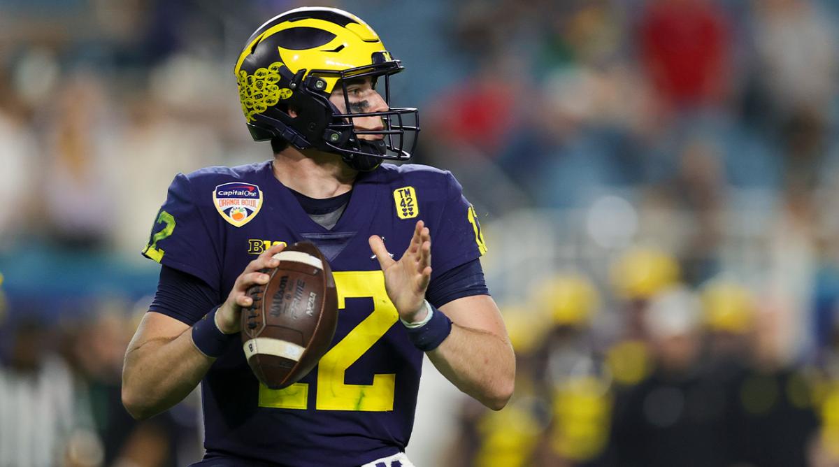 Dec 31, 2021; Miami Gardens, Florida, USA; Michigan Wolverines quarterback Cade McNamara (12) looks to throw against the Georgia Bulldogs in the third quarter during the Orange Bowl college football CFP national semifinal game at Hard Rock Stadium.