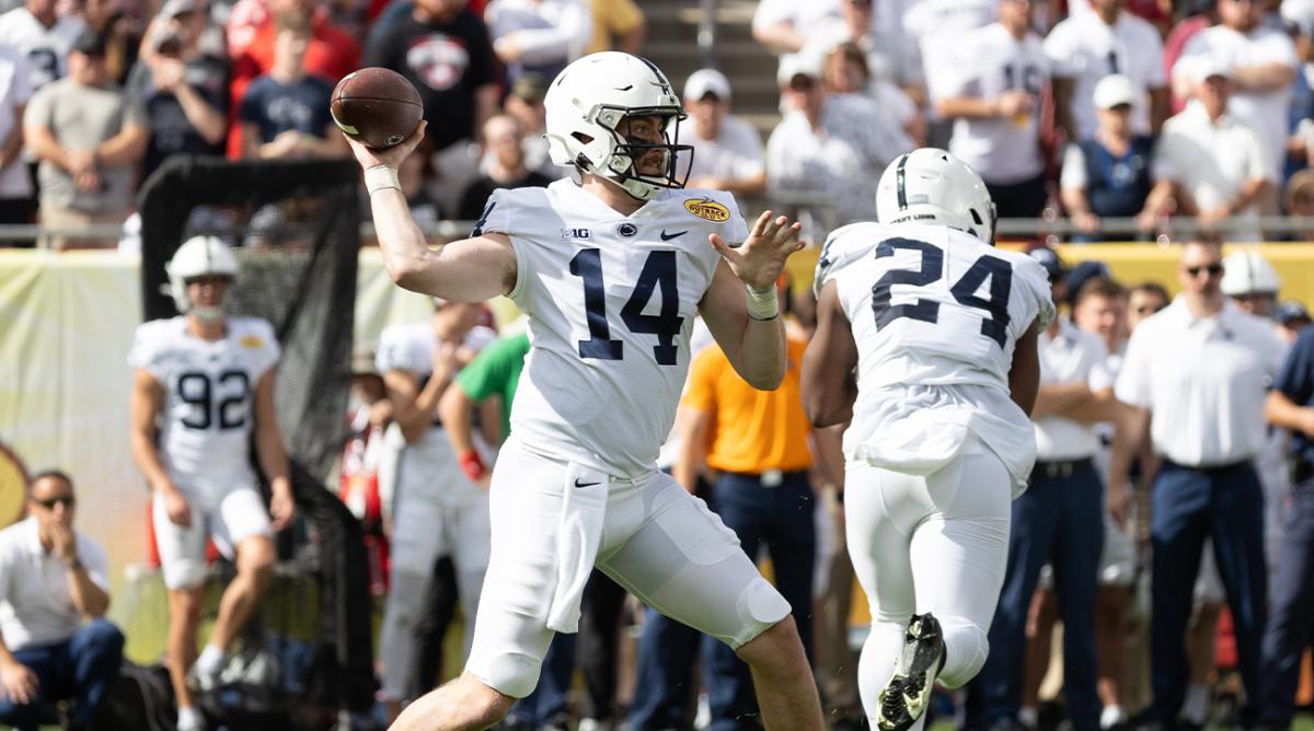 Jan 1, 2022; Tampa, FL, USA; Penn State Nittany Lions quarterback Sean Clifford (14) throws the ball during the first half against the Arkansas Razorbacks during the 2022 Outback Bowl at Raymond James Stadium.