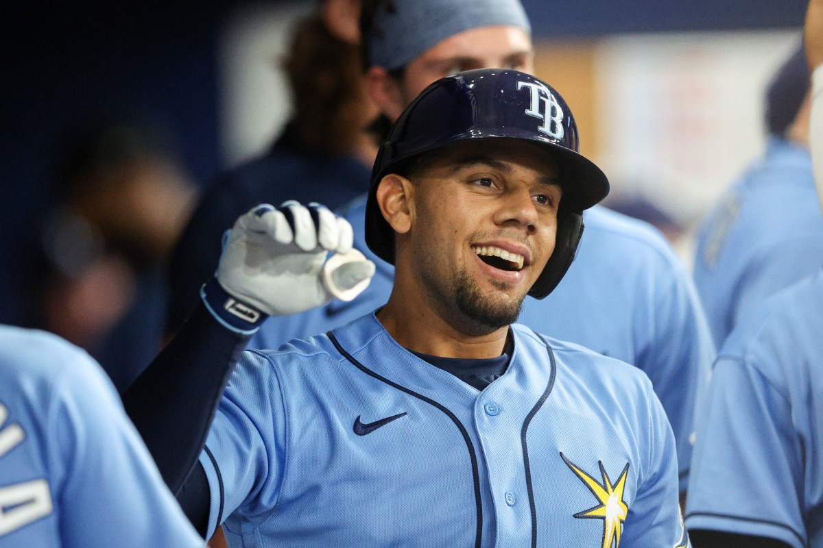 Tampa Bay Rays catcher Rene Pinto (50) is congratulated in the dugout after hitting a two run home run against the Seattle Mariners on April 26 at Tropicana Field. (Nathan Ray Seebeck-USA TODAY Sports)