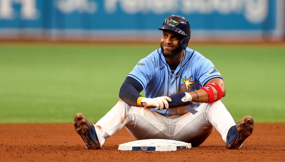 Tampa Bay third baseman Yandy Diaz sits near second base after getting thrown out on the basepaths, a common problem for the Rays. this season. (USA TODAY Sports)