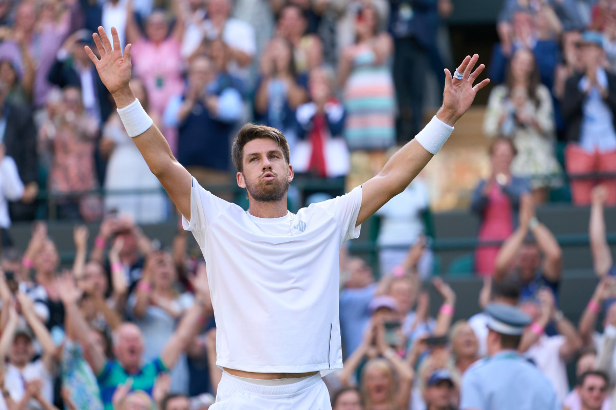 Jul 5, 2022; London, England, United Kingdom; Cameron Norrie (GBR) celebrates after match point against David Goffin (BEL) in a quarterfinals mens singles match on Number One court at the 2022 Wimbledon Championships at All England Lawn Tennis and Croquet Club.
