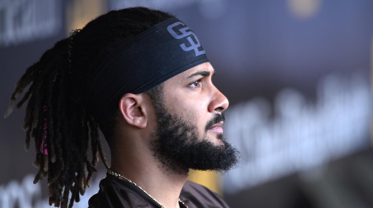 Jun 25, 2022; San Diego, California, USA; San Diego Padres shortstop Fernando Tatis Jr. (23) looks on from the dugout before the game against the Philadelphia Phillies at Petco Park.