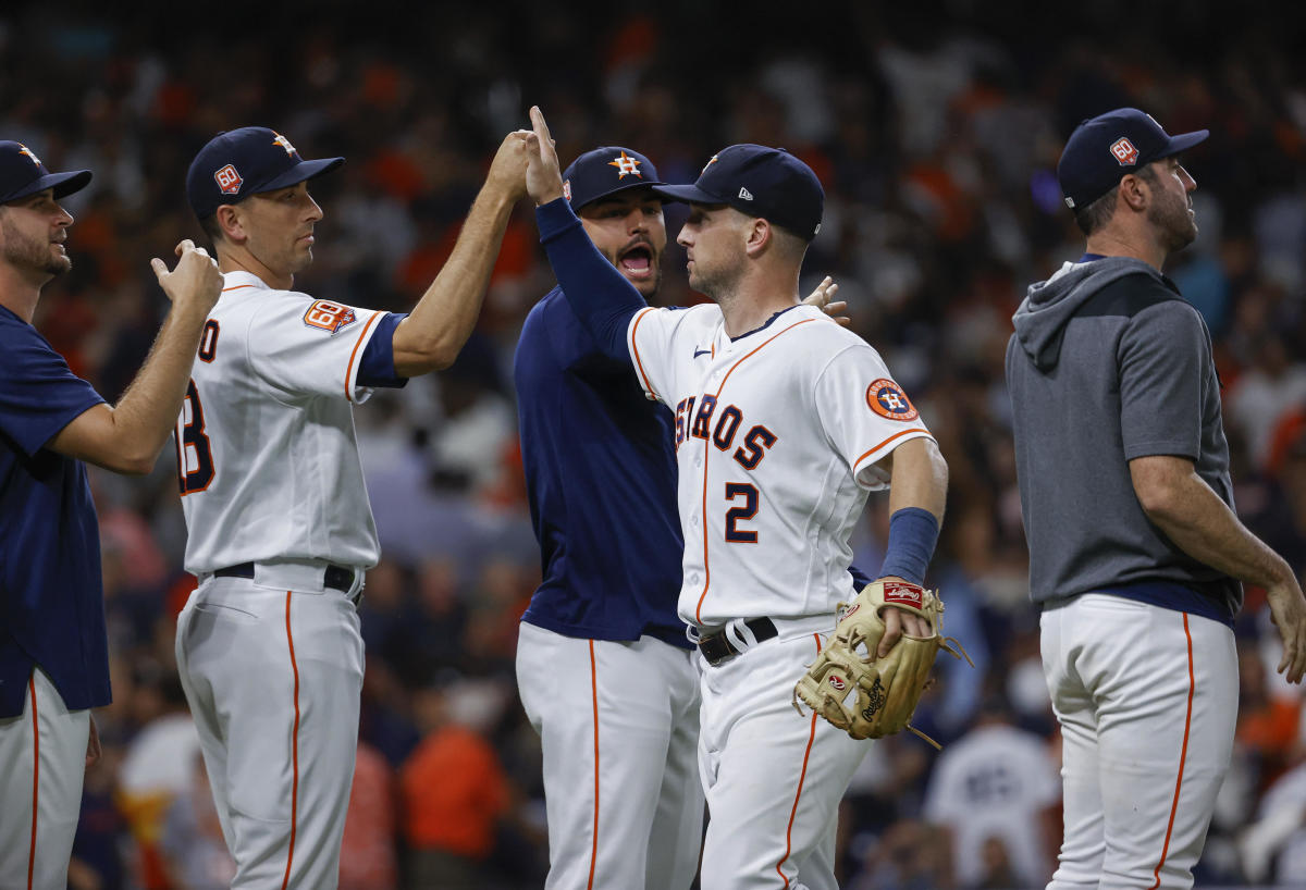 Alex Bregman celebrates with teammates after the Astros defeated the Yankees at Minute Maid Park.