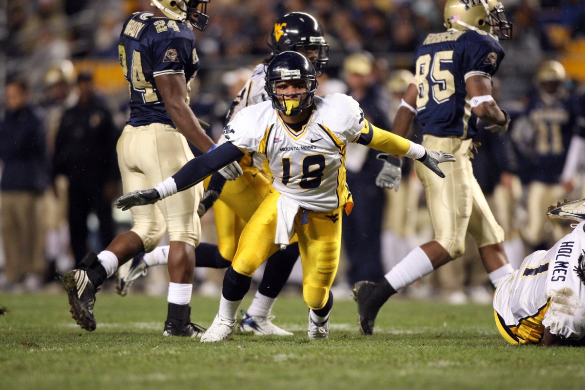 Nov 16, 2006; Pittsburgh , PA, USA; West Virginia tight end Brandon Tate (20) celebrates a tackle on a kickoff in the first half against Pittsburgh at Heinz Field in Pittsburgh, PA.