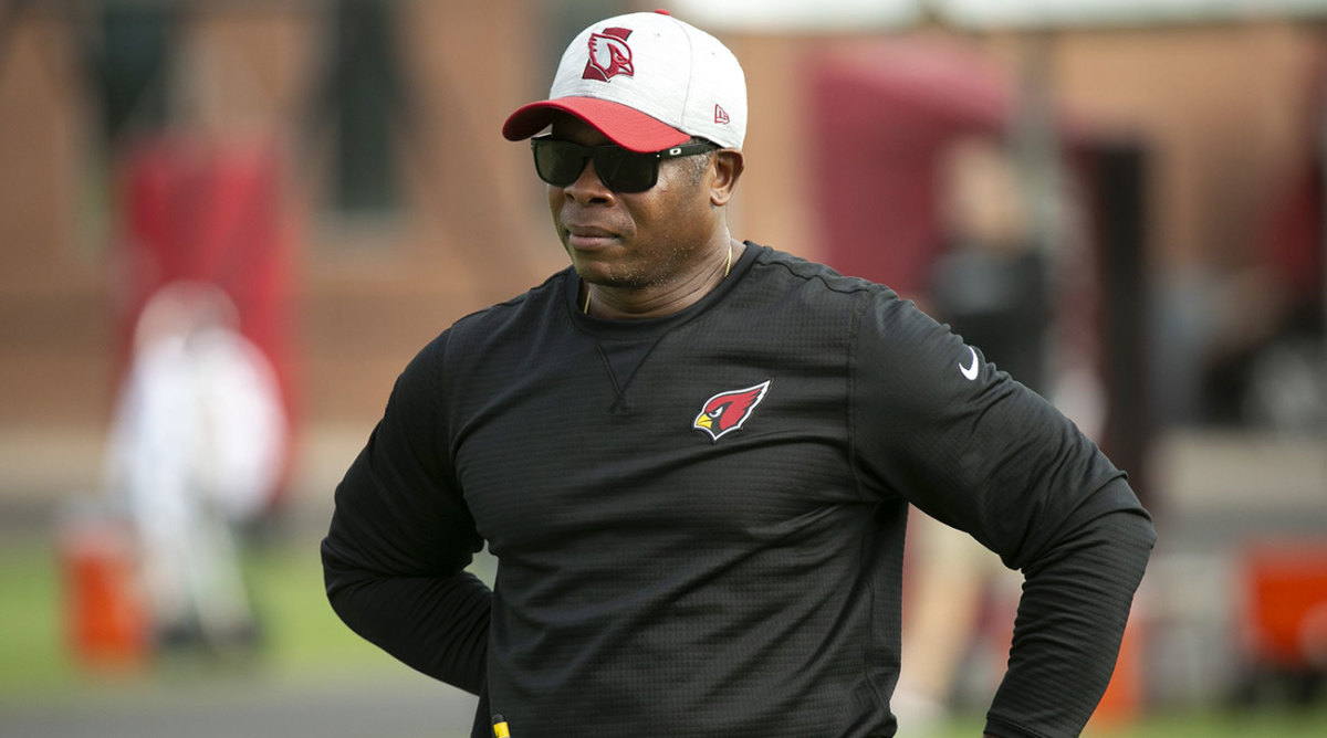 Cardinals DC Vance Joseph looks out at the field during a summer practice