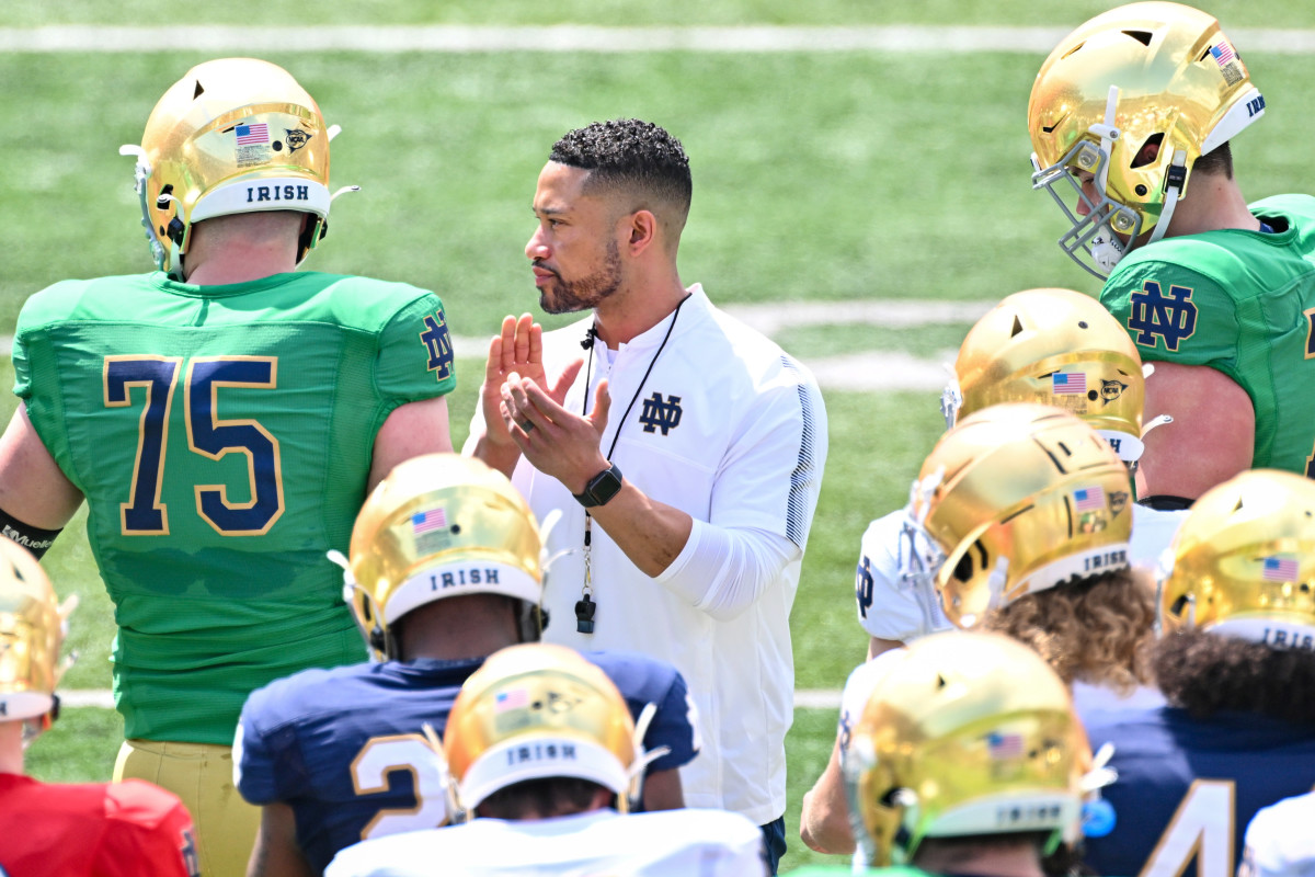 Notre Dame Fighting Irish head coach Marcus Freeman watches warmups before the Blue-Gold Game at Notre Dame Stadium