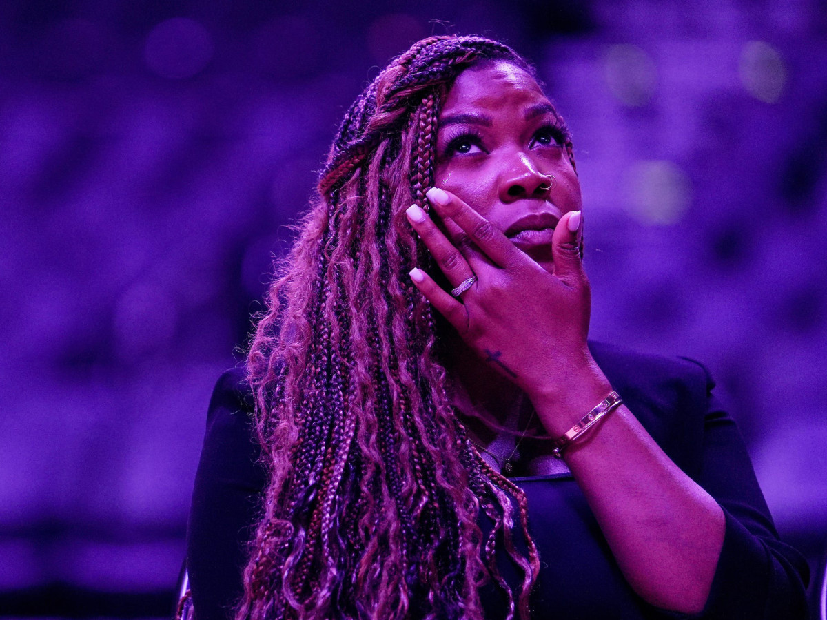 Brittney Griner’s wife, Cherelle, wipes tears from her face at a rally advocating for the Mercury star’s release from a Russian prison.