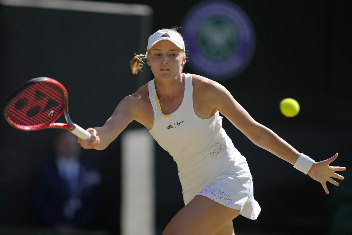 Elena Rybakina returns a ball during a Wimbledon match.