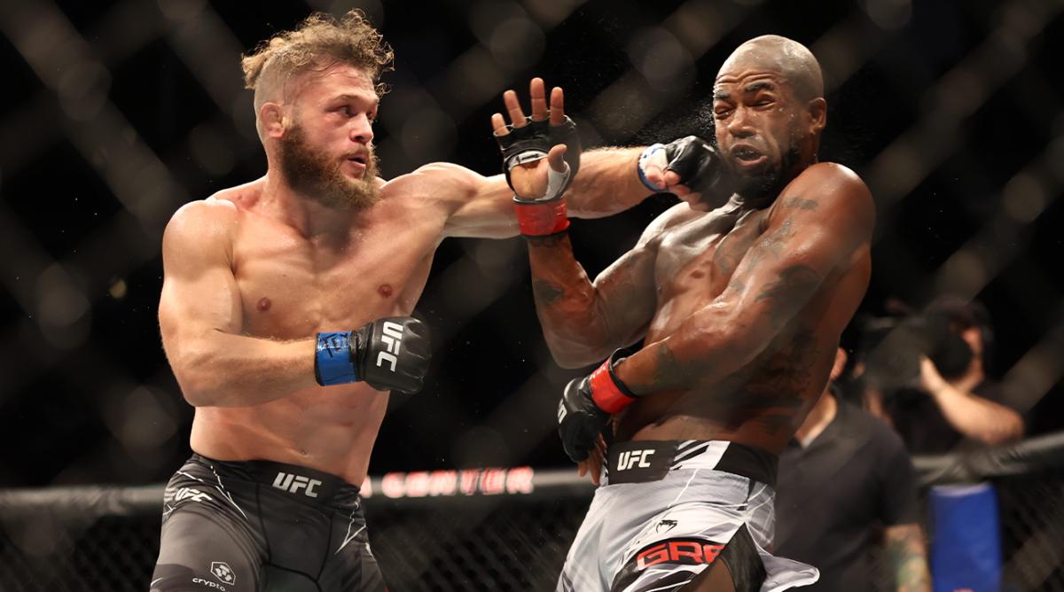 Aug 7, 2021; Houston, Texas, USA; Bobby Green (red gloves) fights Rafael Fiziev (blue gloves) during UFC 265 at Toyota Center.