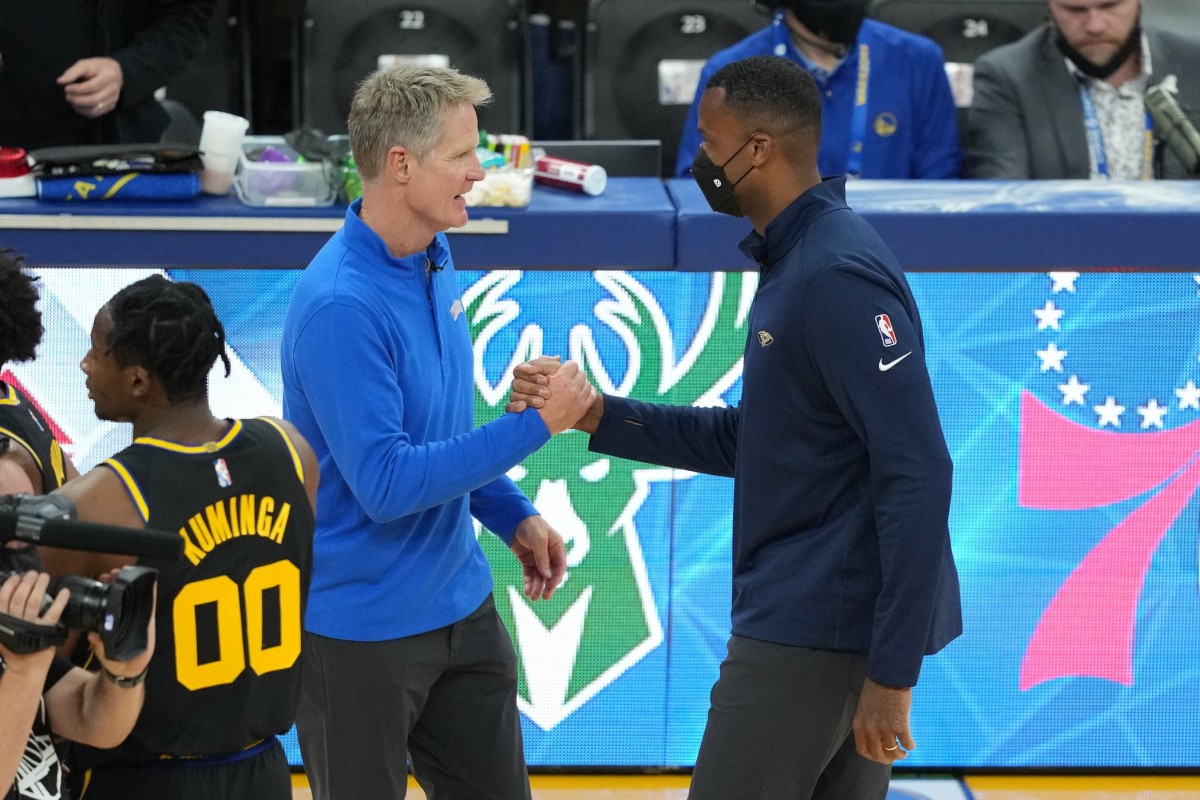 Nov 5, 2021; San Francisco, California, USA; Golden State Warriors head coach Steve Kerr and New Orleans Pelicans assistant coach Jarron Collins shake hands after the game at Chase Center. Mandatory Credit: Darren Yamashita-USA TODAY Sports
