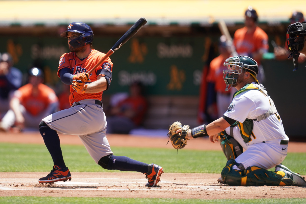 Jose Altuve watches his double travel into left field before leaving the batter's box.