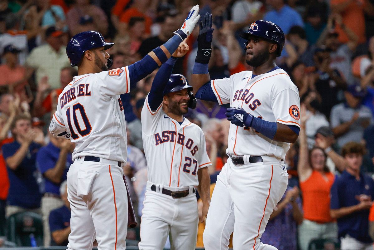 Houston Astros' Yordan Álvarez, José Altuve and Yuri Gurriel