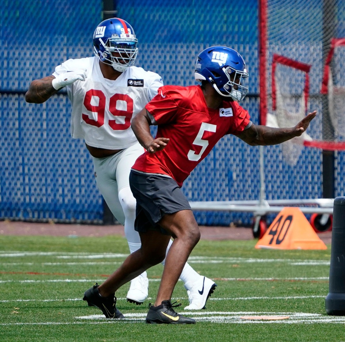 New York Giants defensive end Leonard Williams (99) and rookie linebacker Kayvon Thibodeaux (5) participate in drills during the mandatory minicamp at the Quest Diagnostics Training Center on Tuesday, June 7, 2022, in East Rutherford.