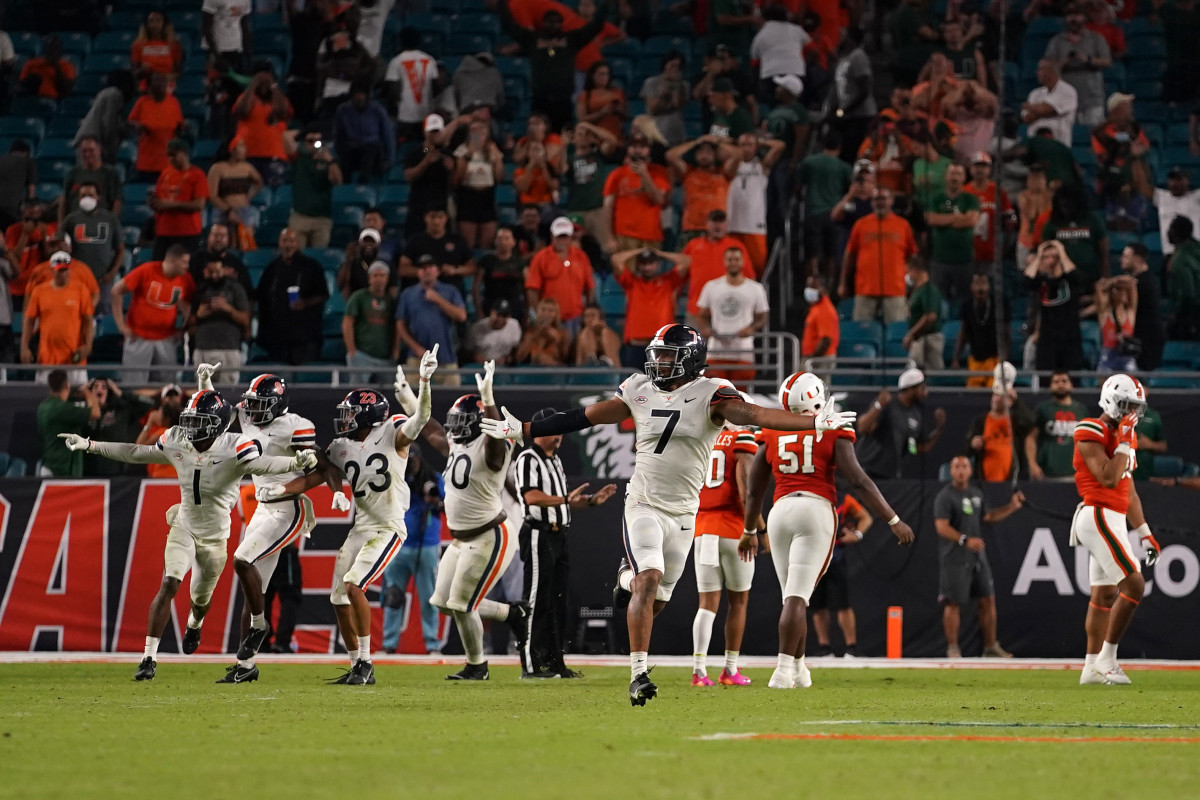Virginia Cavaliers outside linebacker Noah Taylor (7) celebrates after Miami Hurricanes place kicker Andres Borregales (30) misses the game winning field goal during the second half at Hard Rock Stadium.