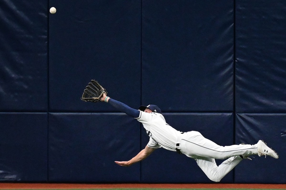 Tampa Bay Rays center fielder Brett Phillips (35) makes a diving catch in the second inning against the Boston Red Sox at Tropicana Field. Mandatory Credit: Jonathan Dyer-USA TODAY Sports