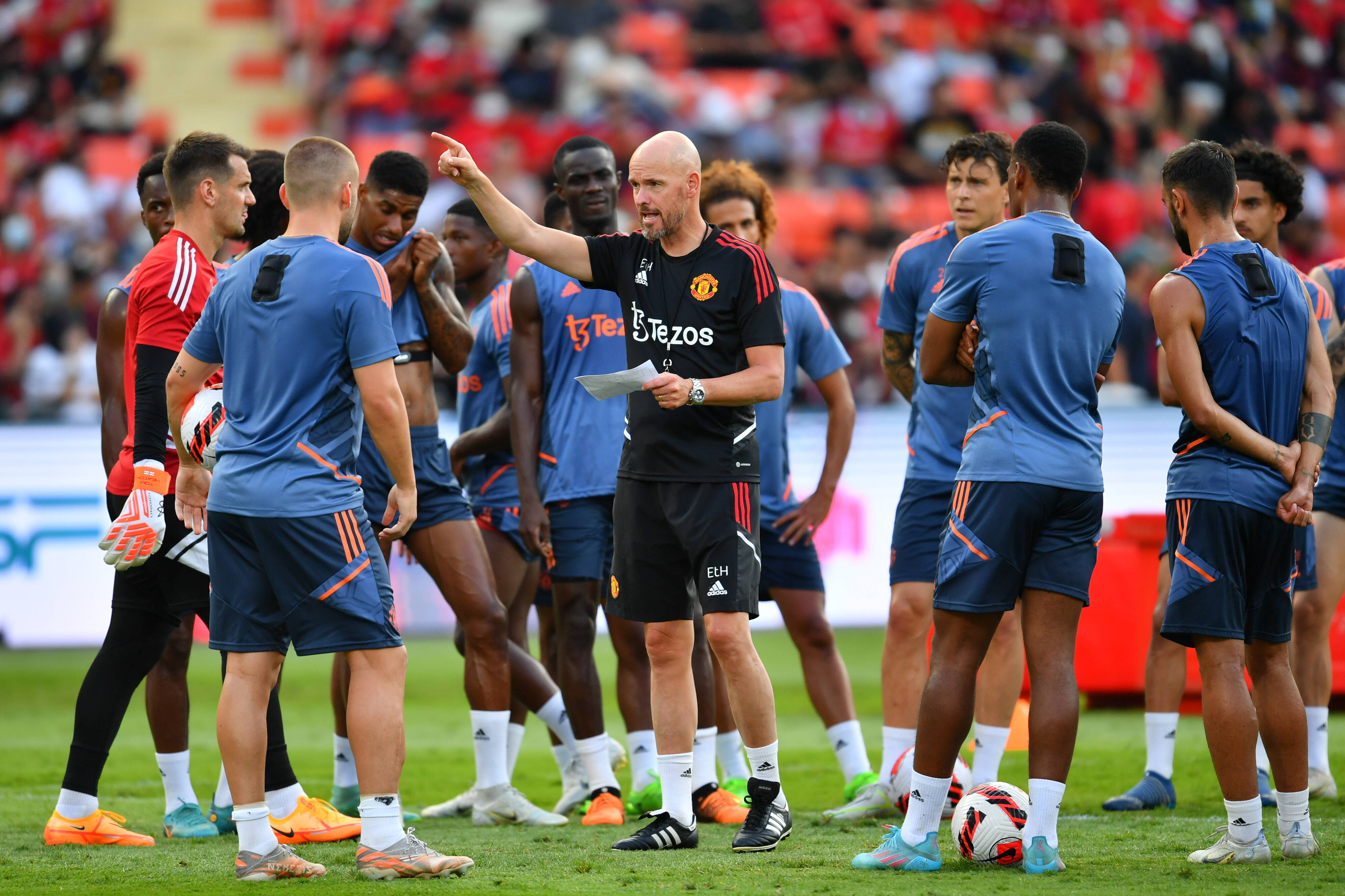 Erik ten Hag (center) pictured giving instructions to his Manchester United players ahead of a friendly game against Liverpool in Thailand in July 2022