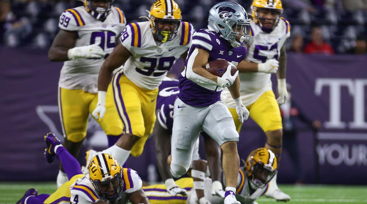 Jan 4, 2022; Houston, TX, USA; Kansas State Wildcats running back Deuce Vaughn (22) runs with the ball during the fourth quarter against the LSU Tigers during the 2022 Texas Bowl at NRG Stadium.