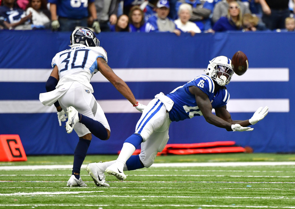Oct 31, 2021; Indianapolis, Indiana, USA; Indianapolis Colts wide receiver Ashton Dulin (16) misses a long pass in from to Tennessee Titans cornerback Greg Mabin (30) during the second half at Lucas Oil Stadium. Titans won 34-31.