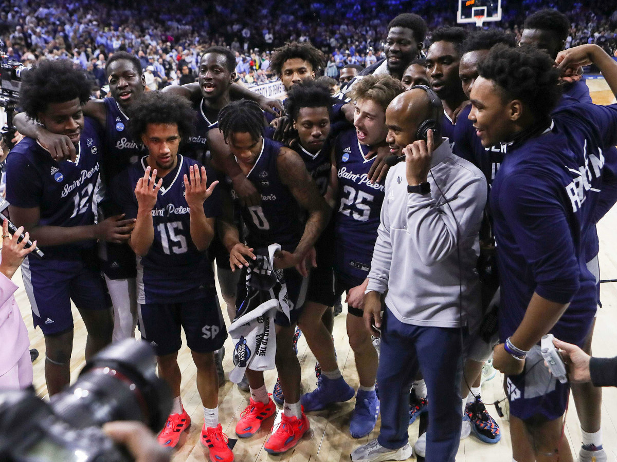 Saint Peter’s and Shaheen Holloway crowd during an interview