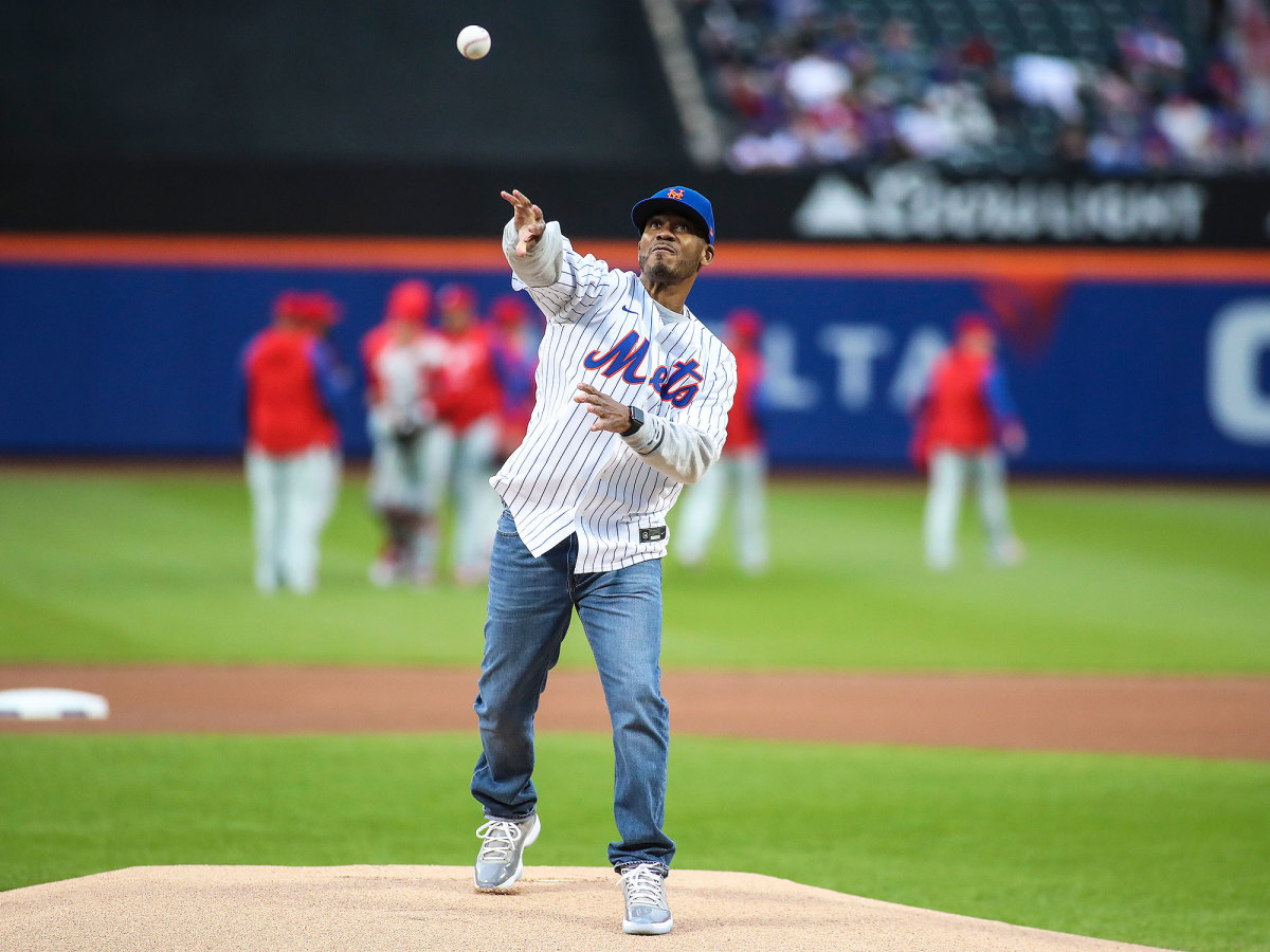 Shaheen Holloway throws the first pitch at a Mets game
