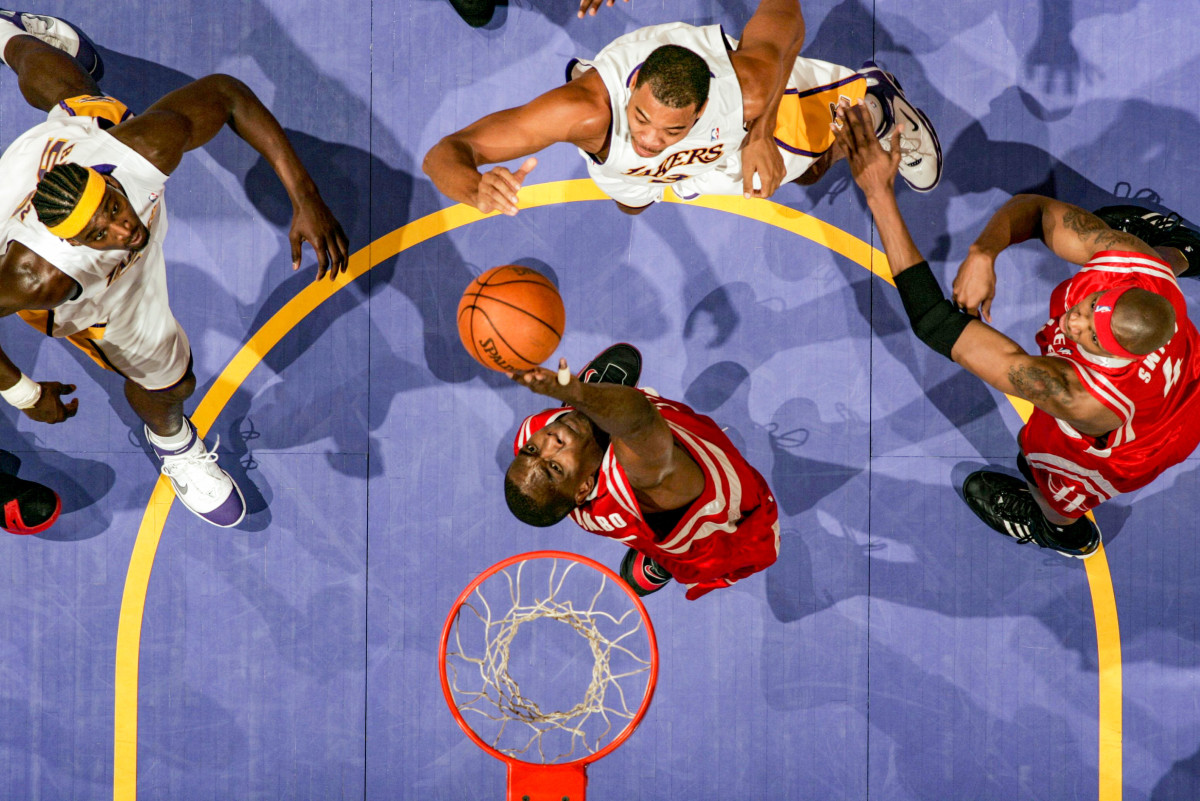 Mutombo, on the Rockets, blocks a shot by the Pacers.