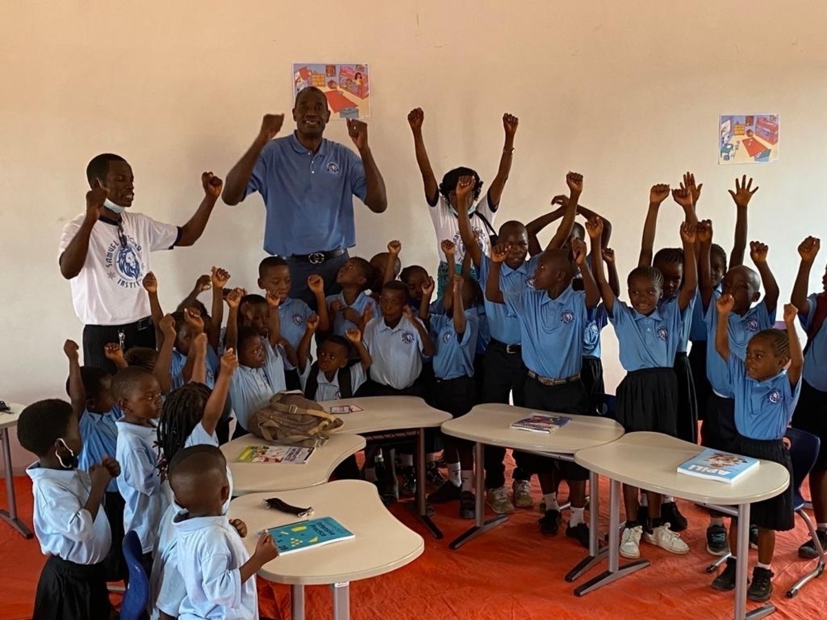 Mutombo at the school he built in Tshibombo village.