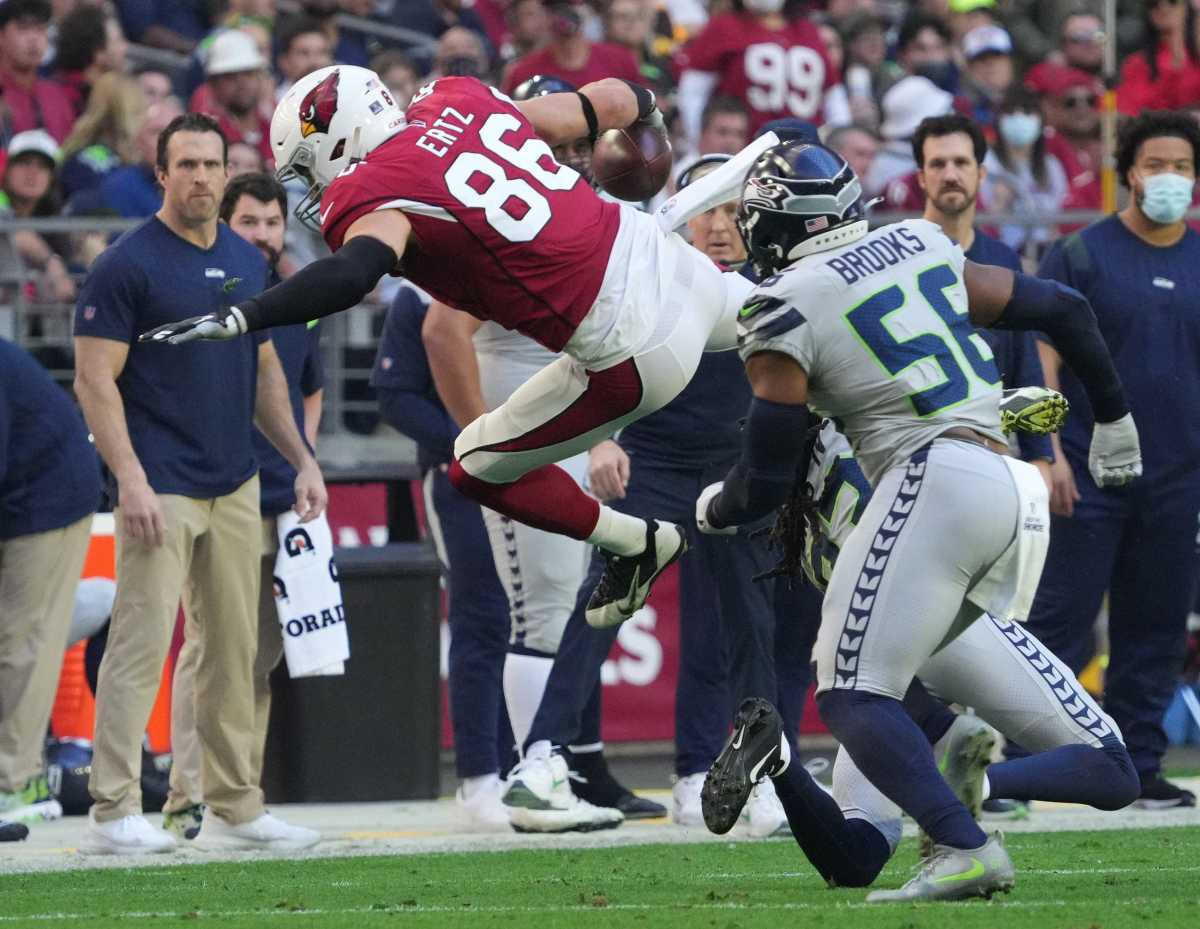 USA; Arizona Cardinals tight end Zach Ertz (86) is tackled by Seattle Seahawks safety Jamal Adams (33) during the first quarter.