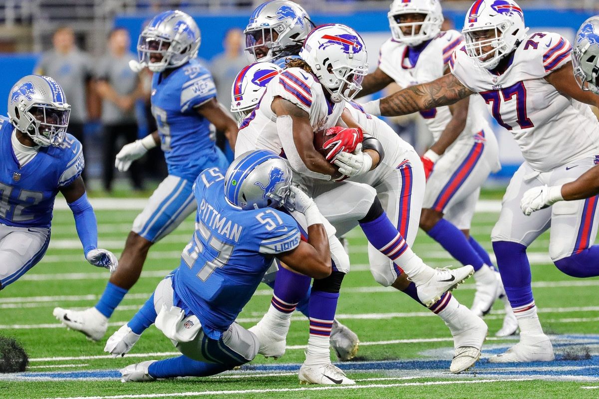 Detroit Lions linebacker Anthony Pittman (57) tackles Buffalo Bills running back Antonio Williams (28) during the second half of the preseason game at Ford Field in Detroit on Friday, Aug. 13, 2021.