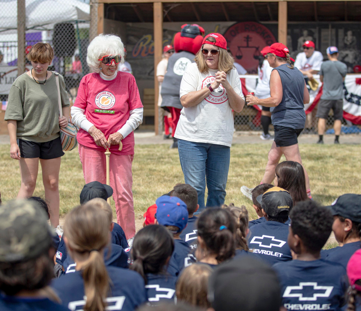 Maybelle Blair, a former member of the All-American Girls Professional Baseball League, and Megan Cavanagh, who played a member of the Rockford Peaches in the 1992 movie “A League of Their Own,” speak to kids on Saturday, July 2, 2022, at Beyer Stadium in Rockford.