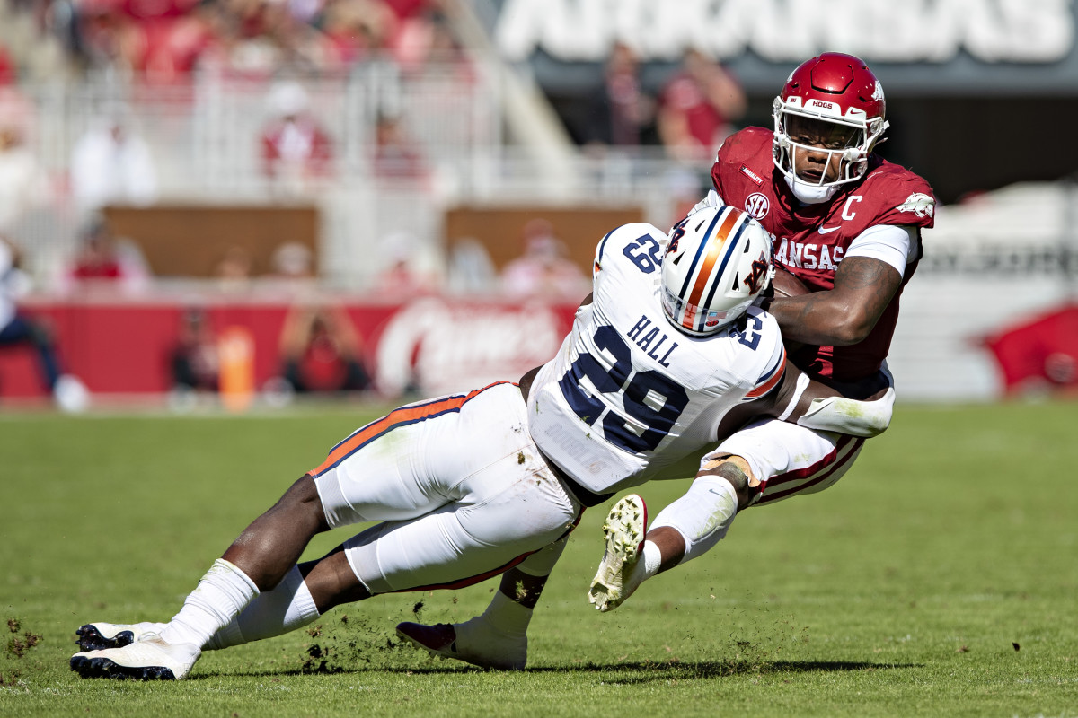 FAYETTEVILLE, ARKANSAS - OCTOBER 16: Derick Hall #29 of the Auburn Tigers tackles KJ Jefferson #1 of the Arkansas Razorbacks in the second half at Donald W. Reynolds Razorback Stadium on October 16, 2021 in Fayetteville, Arkansas. The Tigers defeated the Razorbacks 38-23. (Photo by Wesley Hitt/Getty Images)