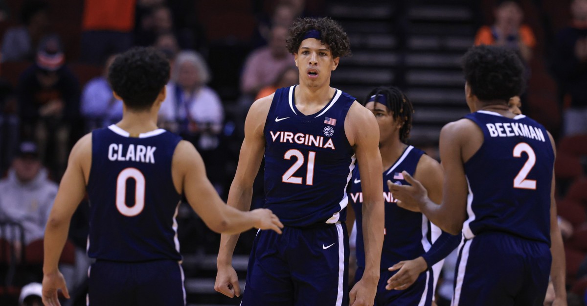 Virginia Cavaliers forward Kadin Shedrick (21) reacts after being folded in front of guard Kihei Clark (0) and guard Reece Beekman (2) during the second half against the Georgia Bulldogs at Prudential Center.