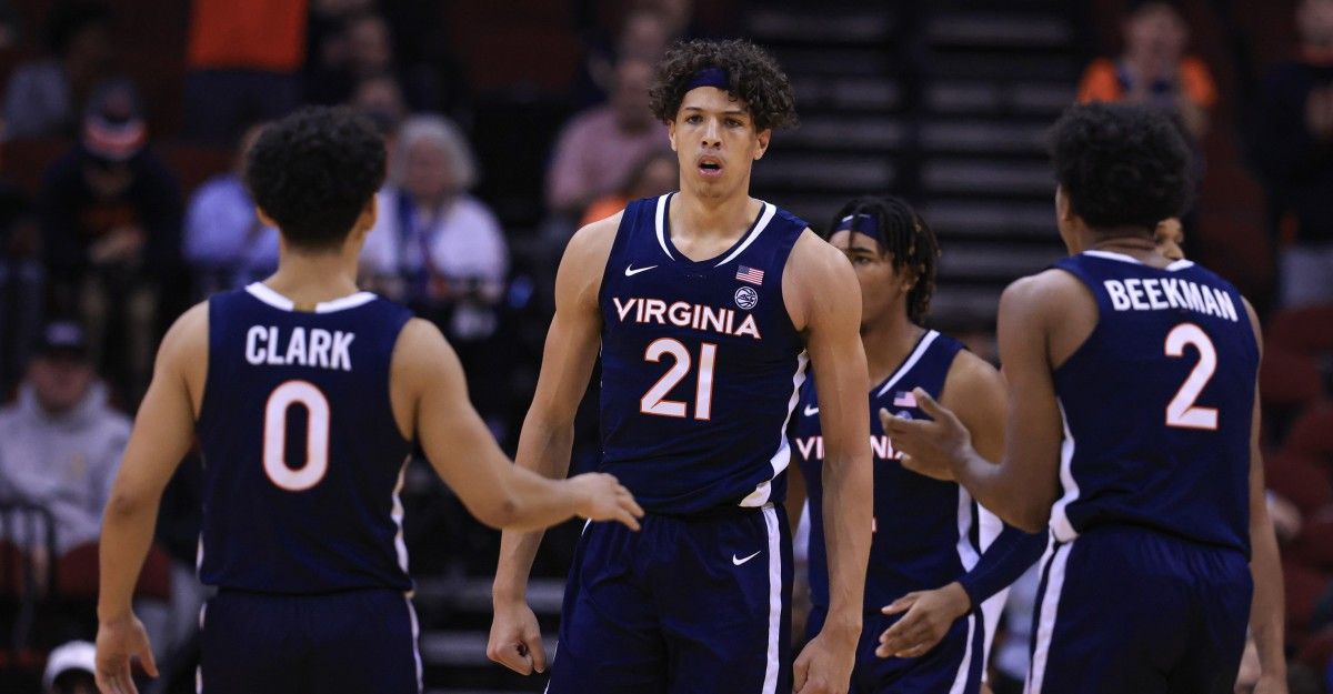 Virginia Cavaliers forward Kadin Shedrick (21) reacts after being folded in front of guard Kihei Clark (0) and guard Reece Beekman (2) during the second half against the Georgia Bulldogs at Prudential Center.