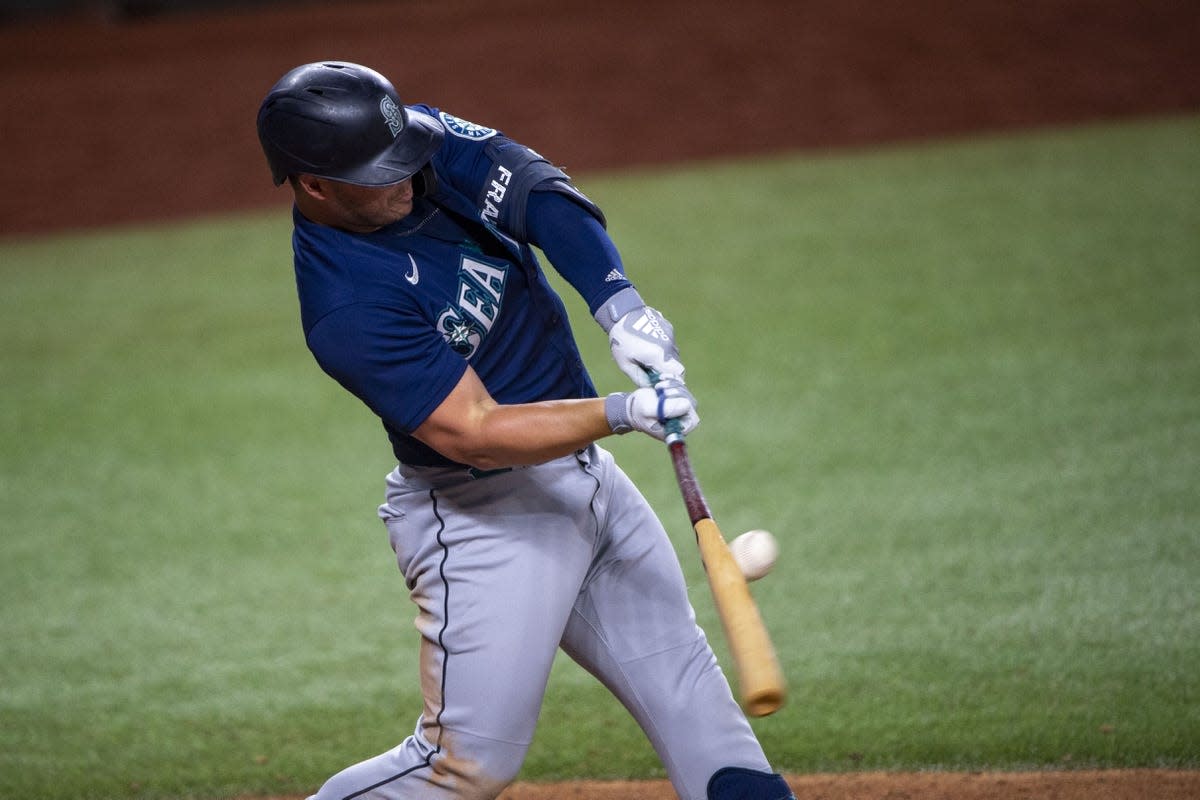 Jul 14, 2022; Arlington, Texas, USA; Seattle Mariners designated hitter Ty France (23) hits a single and drives in two runs against the Texas Rangers during the eighth inning at Globe Life Field. Mandatory Credit: Jerome Miron-USA TODAY Sports