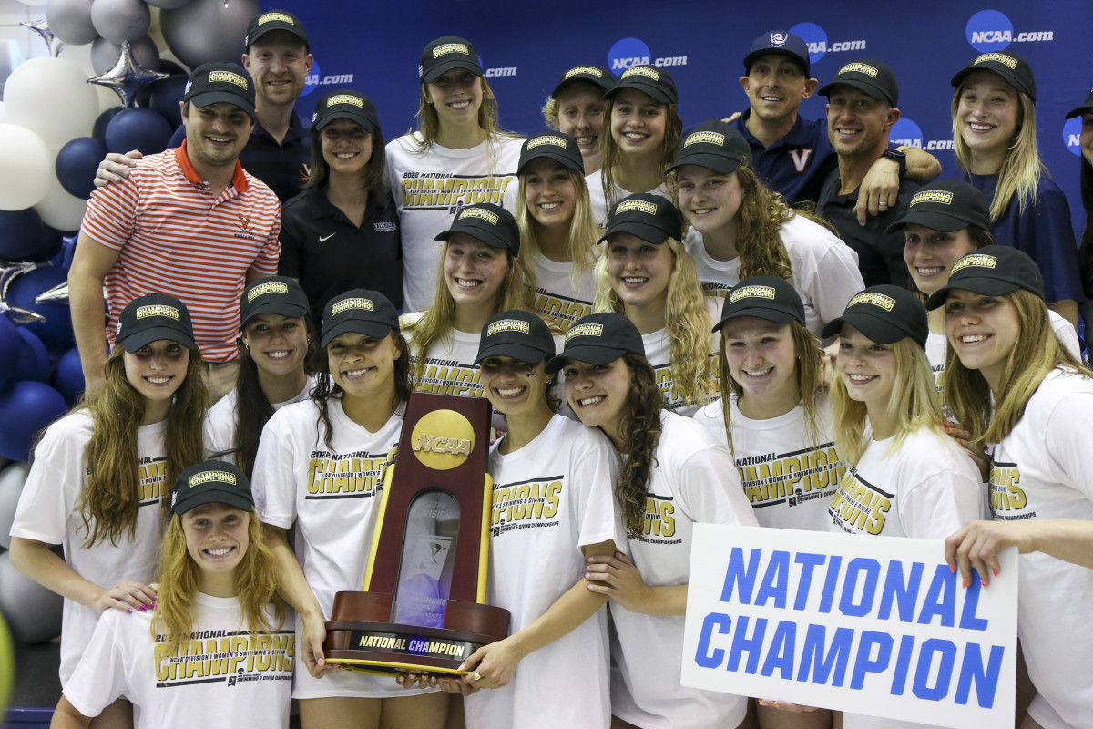 The Virginia Cavaliers women s swim team celebrates after winning the national championship at the NCAA Swimming & Diving Championships at Georgia Tech.