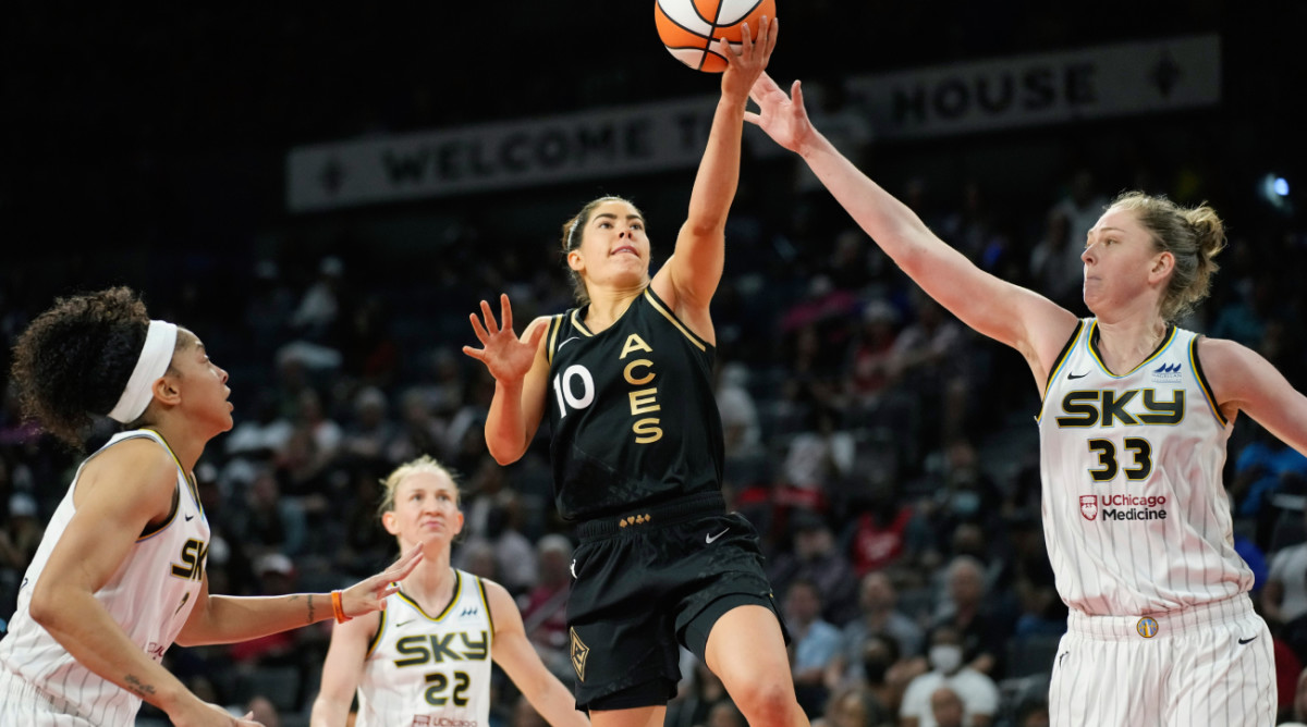 Las Vegas Aces guard Kelsey Plum (10) shoots against Chicago Sky forward Emma Meesseman (33) during the second half of a WNBA basketball game Tuesday, June 21, 2022, in Las Vegas. (AP Photo/John Locher)