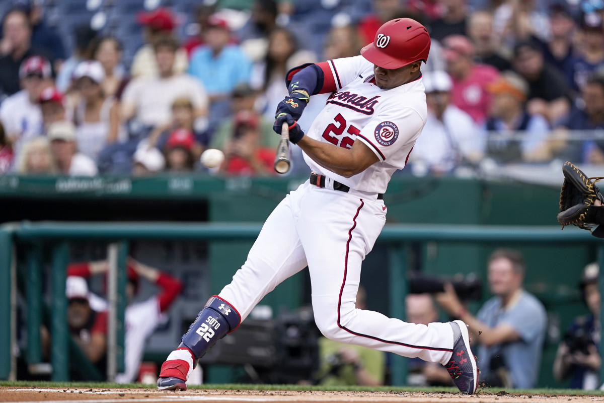 Washington Nationals’ Juan Soto hits a single during the first inning of a baseball game against the Pittsburgh Pirates at Nationals Park, Monday, June 27, 2022, in Washington.