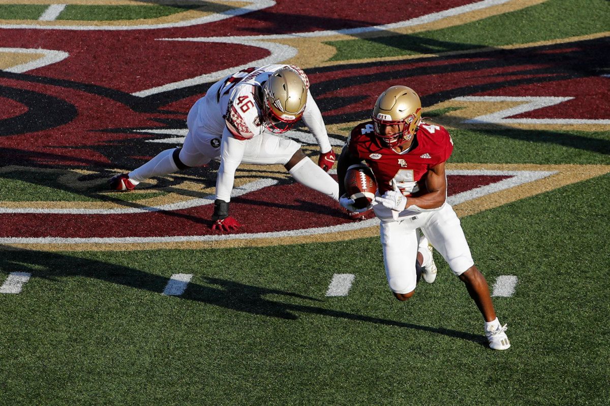 Boston College Eagles wide receiver Zay Flowers (4) runs past Florida State Seminoles linebacker DJ Lundy (46) during the second half at Alumni Stadium.