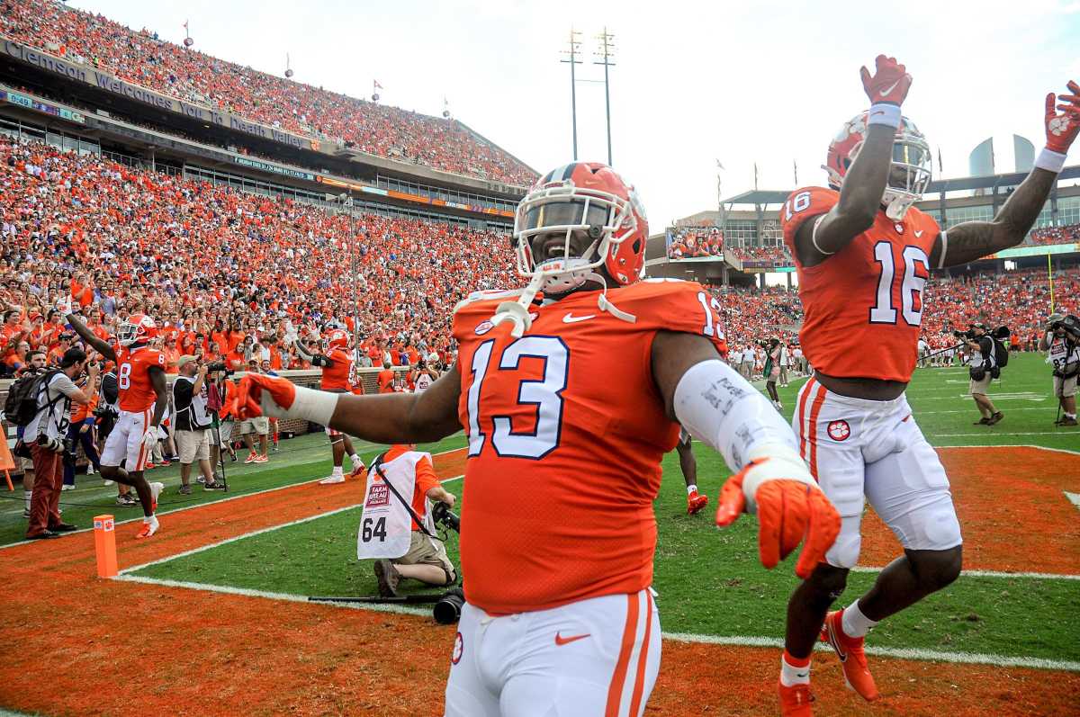 Clemson defensive tackle Tyler Davis (13) and teammates get fans louder before the game with Georgia Tech in Clemson, S.C., September 18, 2021.
