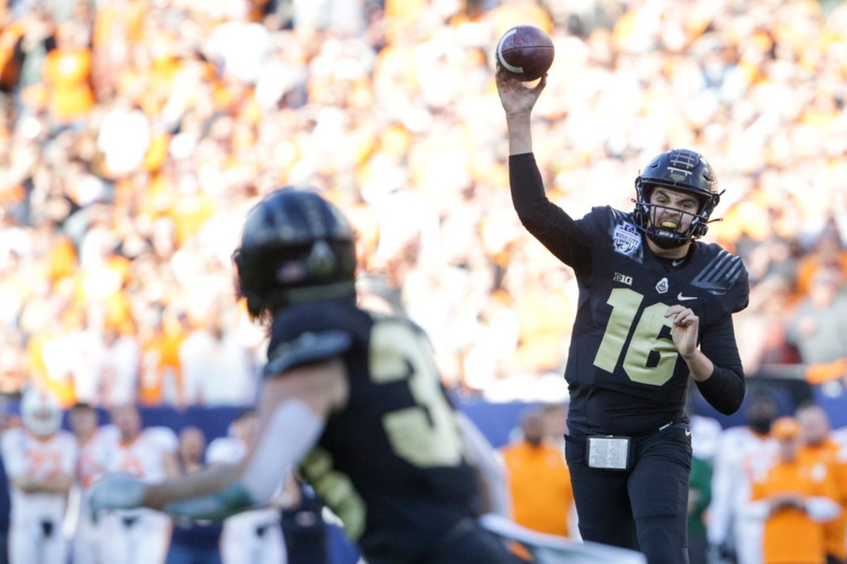 Purdue quarterback Aidan O'Connell throws to wide receiver Jackson Anthrop during the first quarter of the Music City Bowl on Thursday, Dec. 30, 2021, at Nissan Stadium in Nashville. 
