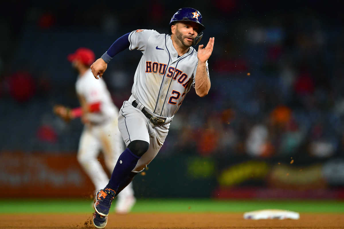 José Altuve sprints to third base in a game against the Los Angeles Angels.