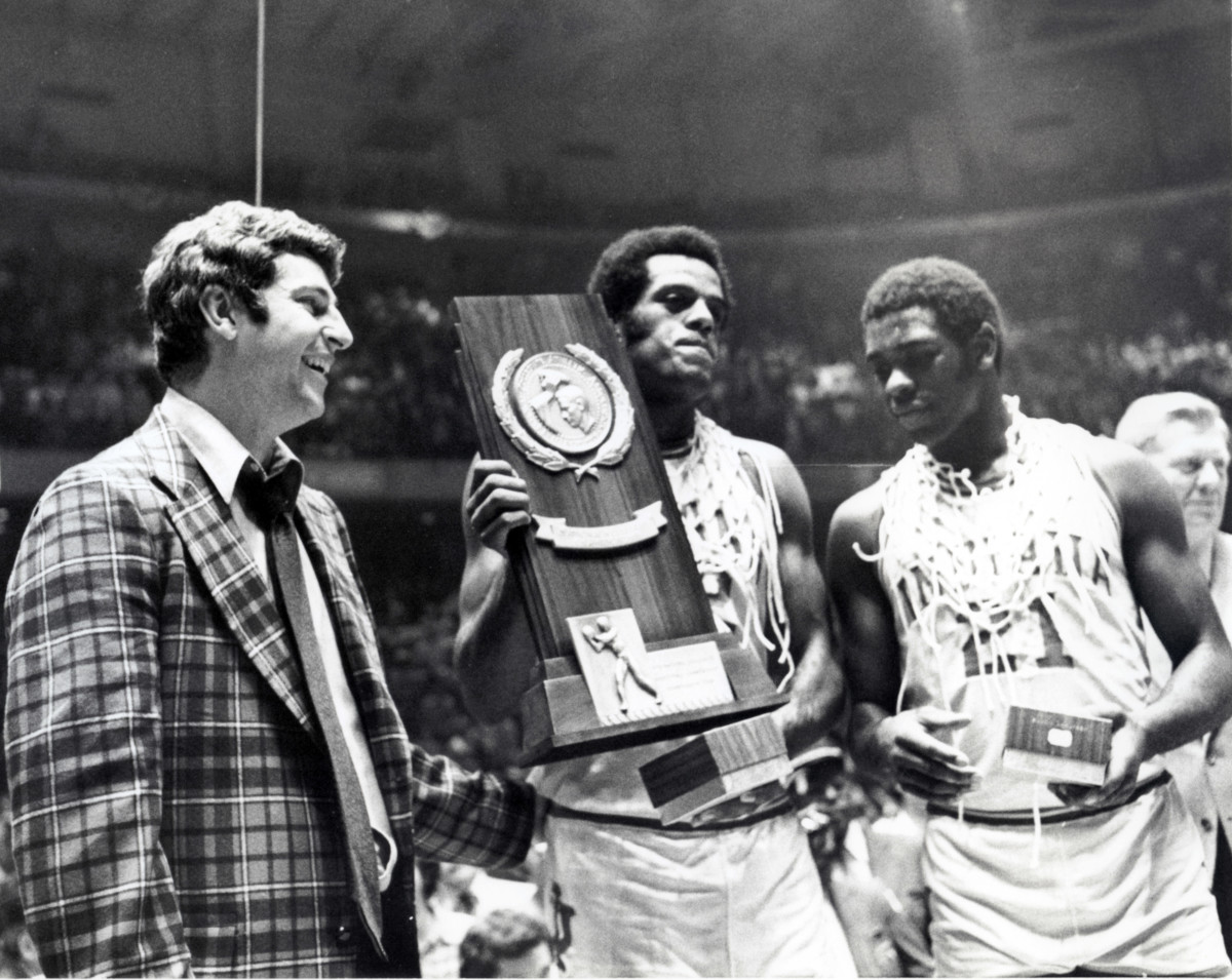 Quinn Buckner and Scott May celebrate with Coach Bob Knight after winning the 1976 NCAA championship.