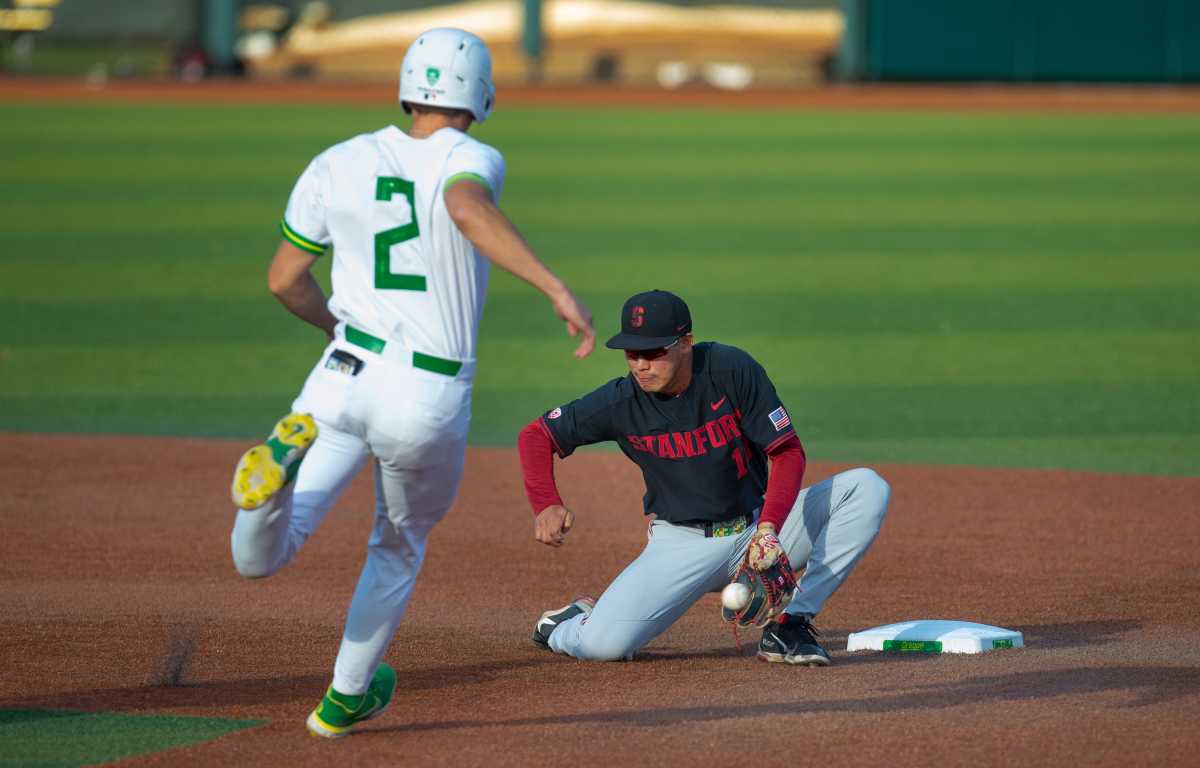 Oregon's Jack Scanlon, left, tries to steal second ahead of the tag by Stanford's Adam Crampton during the third inning.