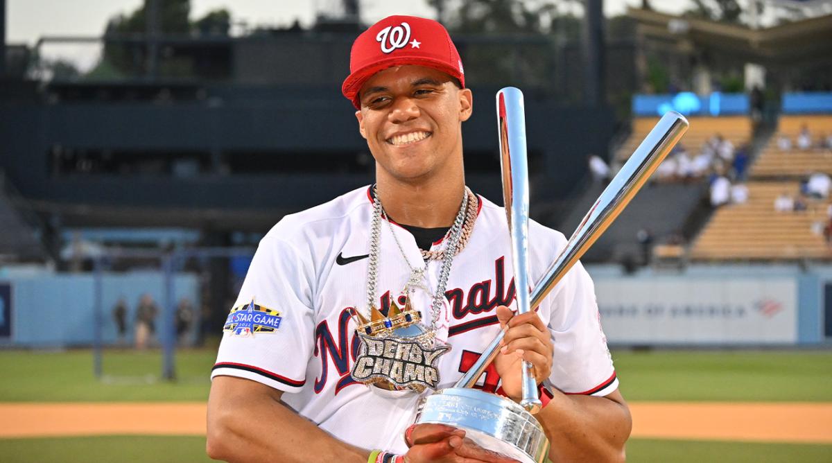 Jul 18, 2022; Los Angeles, CA, USA; Washington Nationals right fielder Juan Soto (22) celebrates with the trophy and his coach Jorge Meija after winning the 2022 Home Run Derby at Dodgers Stadium.